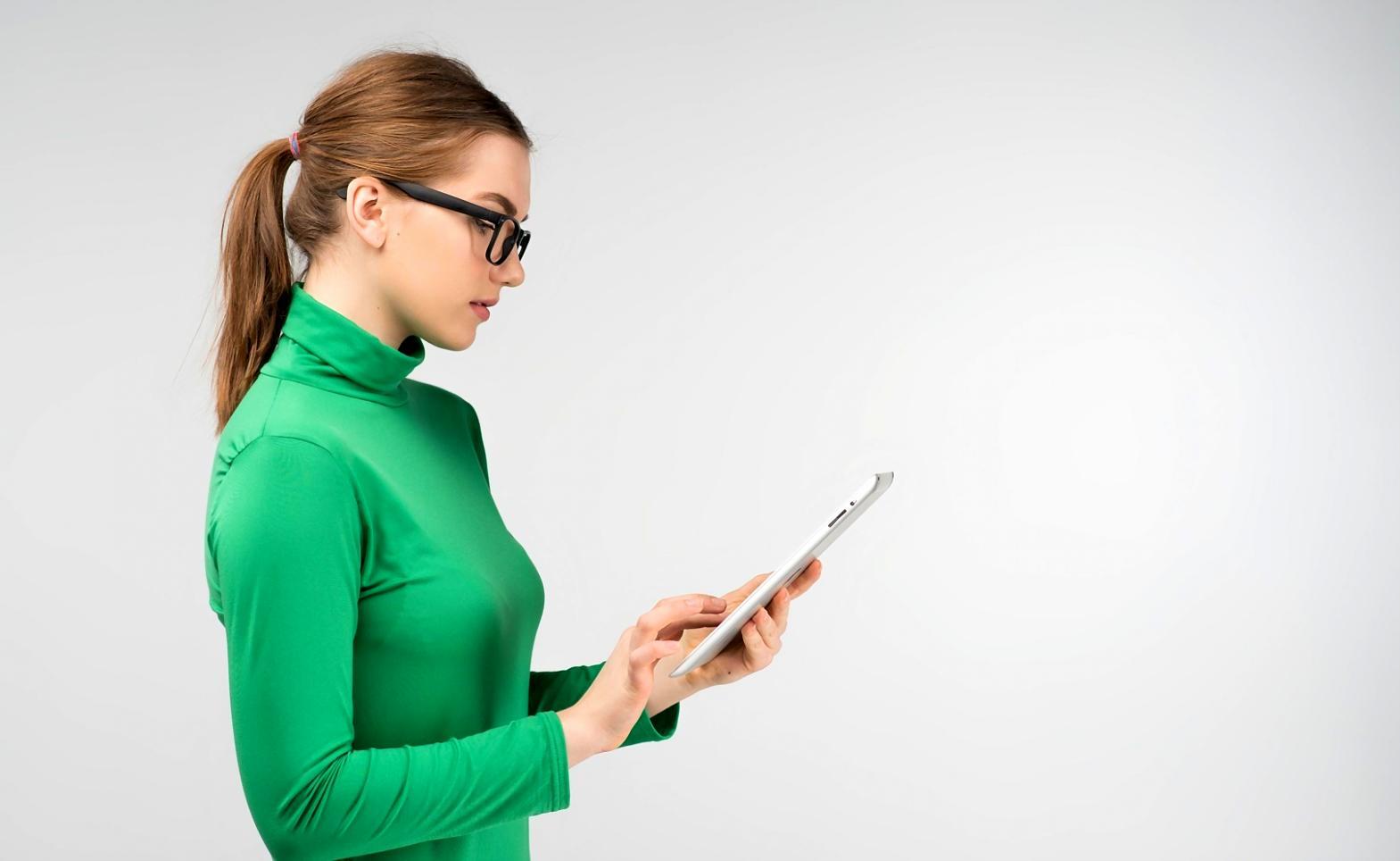 Team reviewing performance metrics on multiple devices